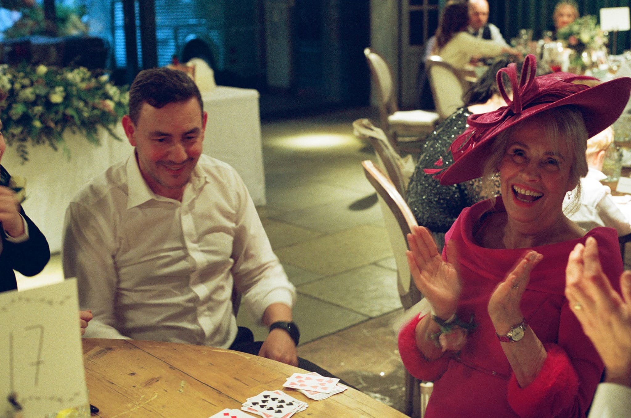 guest reacts to an magic trick with astonishment